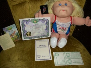 Muñeca parche col olímpica primera edición 1996 EE. UU. con prendedor de ciclismo olímpico 1996 - Imagen 1 de 4