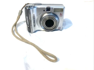 Canon PowerShot A560 7,1 MP 4x zoom ottico fotocamera digitale argento PER PARTE non testata - Foto 1 di 11