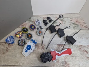 Pacchetto Beyblade, con lanciatori, filatori, accessori, ricambi e pezzi - Foto 1 di 23