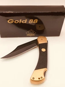 Puma 230 366 1988 oro 88 24kt. Cuchillo dorado con asas a cuadros caja NUEVA - Imagen 1 de 6