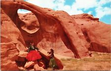 postcard Navajo Women by rock formation - Arizona