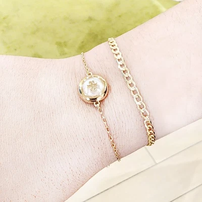 Autêntica pulseira deslizante Tory Burch folheada a ouro 18K madrepérola 168605 - Imagem 1 de 4