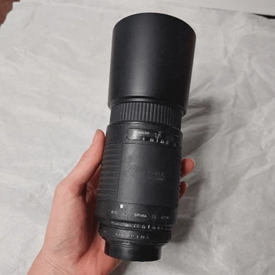 Lente de enfoque automático Sigma DL Zoom 75-300 mm 1:4-5,6 con parasol Foto 1 de 4