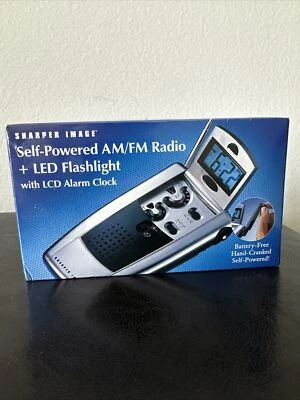 Sharper Image Self Powered AM/FM Radio + Led Flashlight With alarm Clock - Image 1 of 4