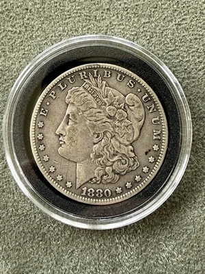 Dólar de plata Morgan 1880-O Foto 1 de 2