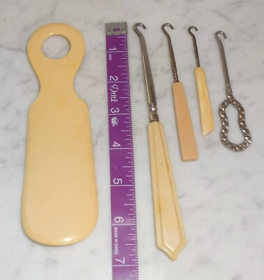 LOT OF 4 VINTAGE ANTIQUE SHOE BUTTON HOOKS & a SHOE HORN - Ivory color handles - Image 1 of 2