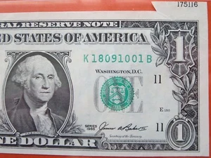 $1 1985 federal reserve note error: miss cut 26-031 - Picture 1 of 3