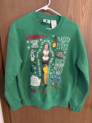 Sudadera Elf The Movie Will Ferrell Cuello Redondo Verde Mediana Hablando Sonriendo Foto 1 de 4