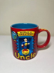 Taza de superhéroe tío más grande del mundo 2004 de colección con figura giratoria - Imagen 1 de 7