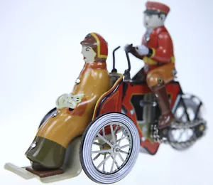 CLASSIC WIND-UP   TIN TOY MAN ON TRIKE & LADY WITH CAT  - Picture 1 of 3