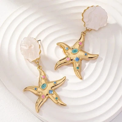 Pendientes Multicolor Pastel Estrella Pez Tono Dorado Perforados Concha de Mar Playa Vaycay Foto 1 de 4