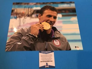 Foto firmada por Ryan Lochte olímpica de natación automática 11x14 Beckett BAJO CERTIFICADO DE AUTENTICIDAD - Imagen 1 de 2