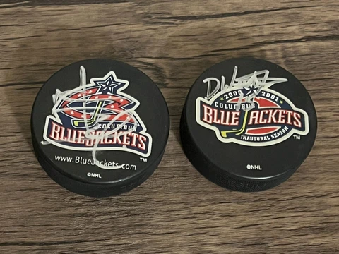 (2) Columbus Blue Jackets hockey pucks lot Cover