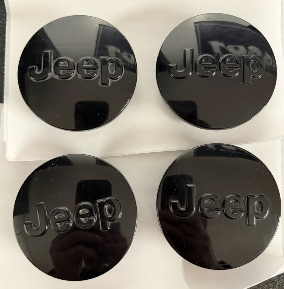 JUEGO DE TAPAS CENTRALES DE RUEDA JEEP WRANGLER GRAND CHEROKEE OEM NEGRO BRILLANTE 1LB77TRMAC Foto 1 de 2