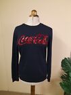navy sweatshirt  ladies size 10 with sparkle writing in red Coca-Cola.   Lovely Only £15.00 on eBay