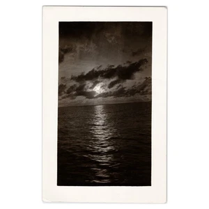 Snapshot Photo of Sunset Over Ocean - 1930s Crooked Horizon Seascape and Clouds - Picture 1 of 2