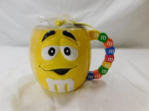 M&M Galerie Gelb Becher Kaffeetasse Erhöhtes Gesicht Mehrfarbig M&M Henkel - Bild 1 von 3