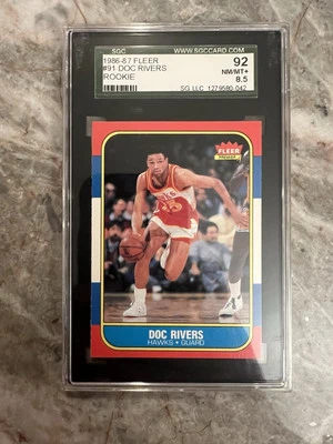 1986 Fleer Basketball Doc Rivers RC graded SGC 92 (8.5) card# 91 - Image 1 of 2