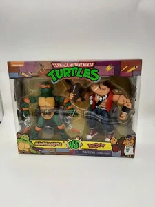 Teenage Mutant Ninja Turtles TMNT Michelangelo VS Bebop Action Figures Brand New - Picture 1 of 6