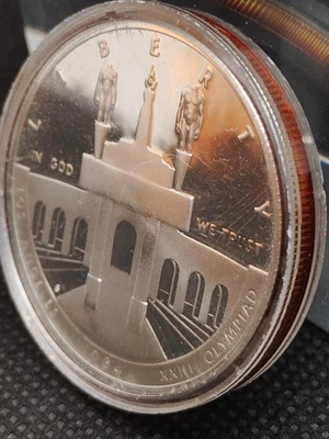 Encased 1984-S ONE DOLLAR XXIII LOS ANGELES OLYMPIAD COMMEMORATIVE SILVER COIN - Image 1 of 4