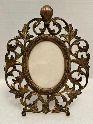 Caballete antiguo vintage de hierro fundido de latón dorado arte ornamentado ovalado marco de fotos Foto 1 de 4