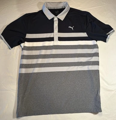 Polo de golf Puma grande MATTR unidireccional para hombre en gris azul marino y blanco Foto 1 de 4