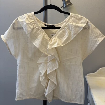 Top Zara básico con volantes marfil Foto 1 de 3