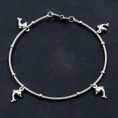 Brazalete redondo de delfín de oro blanco de 18k Foto 1 de 4