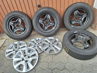 Reifen auf Felge mit Original Opel Radabdeckung - Bild 1 von 4