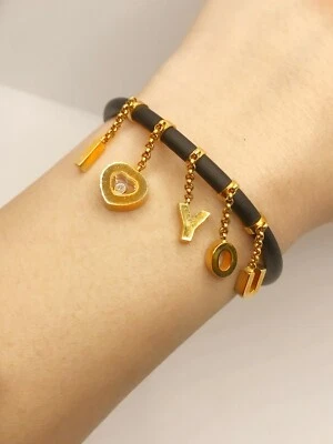Pulsera Chopard "Happy Diamonds" I Love You Charm y goma negra  Foto 1 de 4