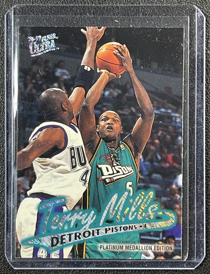 TERRY MILLS 1996 FLEER ULTRA #P-182 PLATINUM MEDALLION PISTONS - Image 1 of 2