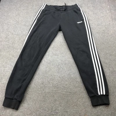 Pantalones deportivos Adidas para hombre medianos negros blancos tres rayas cónicos Foto 1 de 4