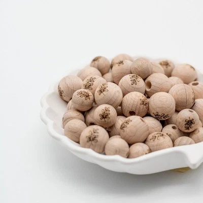 Perla in legno incisione fatta a mano "Eucalipto" 12mm/15mm - Immagine 1 di 2