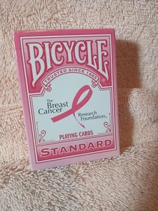 Base de Investigación del Cáncer de Mama para Juegos de Bicicleta Rosa Sellada de Fábrica Nueva - Imagen 1 de 4