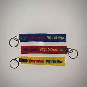 Porte-clés Vovinam-Viet Vo Dao brodé "C" - Imagen 1 de 13