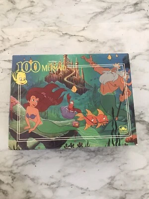 Rompecabezas de 100 piezas de colección de Disney La Sirenita libros dorados Foto 1 de 2