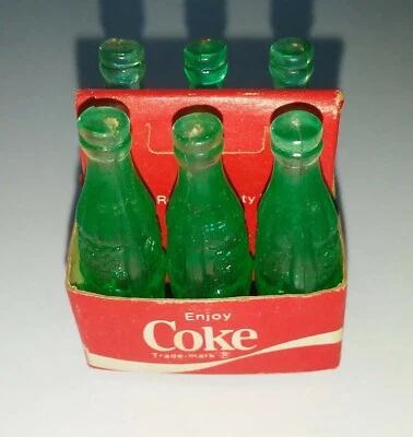 Paquete de 6 botellas de cartón de papel verde claro de Coca Cola (años 80) Foto 1 de 2
