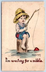1910's FISHING BOY WAITING FOR A NIBBLE ARTIST E HARTMANN SCHLESINGER POSTCARD - Picture 1 of 2