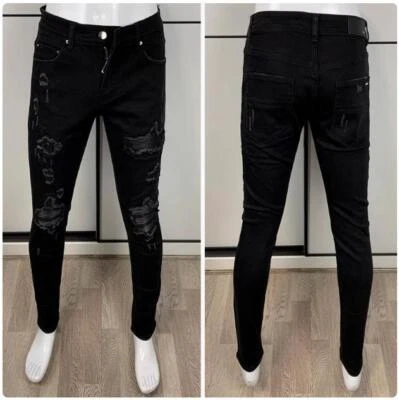 Pantalones de mezclilla elásticos ajustados plisados de PU rasgados con orificio en la rodilla punk para hombre Foto 1 de 4