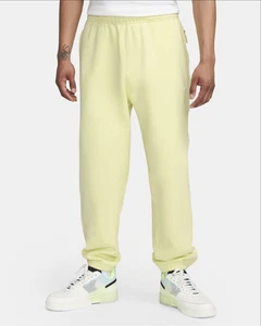 Pantalones de vellón para hombre Nike Solo Swoosh calce holgado amarillo DX1364 331 - Imagen 1 de 9