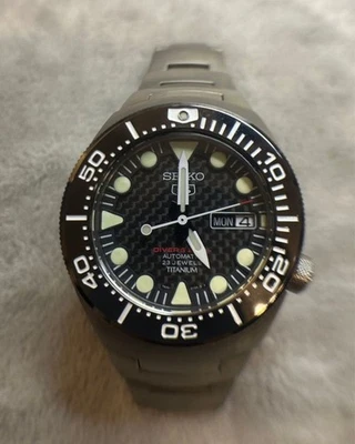 Auténtico reloj automático para hombre Seiko Seiko 5 7S36 día fecha titanio negro SLV 200M Foto 1 de 4