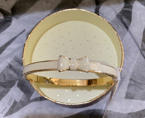 BRACCIALE NUOVO CON ETICHETTA KATE SPADE 2014 Prendi un fiocco in crema placcato oro