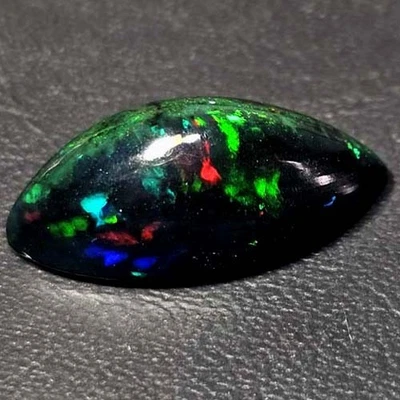 NATURAL AAA+ BEAUTIFUL COLORPLAY MARQUISE CABOCHAN  ETHIOPIAN BLACK OPAL 3.65CTS - Image 1 of 3