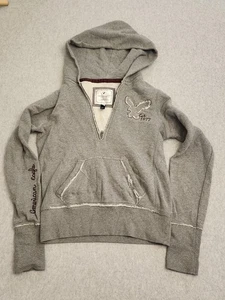 Felpa con cappuccio American Eagle Outfitters donna XS grigia mezza zip aquila 1977 invecchiata - Foto 1 di 15