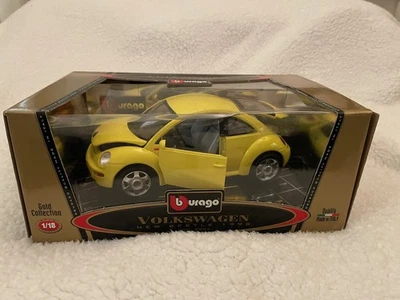 BURAGO 1/18 VOLKSWAGEN NEW BEETLE 1998 - YELLOW IN ORIGINAL BOX  - Image 1 of 4