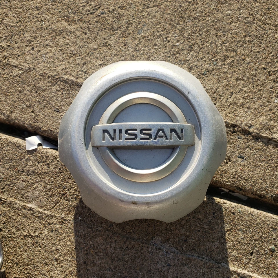 1 calota central de roda Nissan Xterra Frontier 00 01 02 2003 2004 40315-1Z800 - Imagem 1 de 4