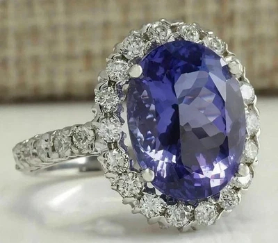 Anillo de compromiso con halo de zafiro creado en laboratorio de corte ovalado de 3,50 quilates enchapado en oro blanco de 14 quilates Foto 1 de 4