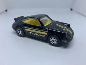 Corgi - Porsche Carrera 911 Negro/Amarillo - Diecast - Escala 1:64 - USADO - Imagen 1 de 3