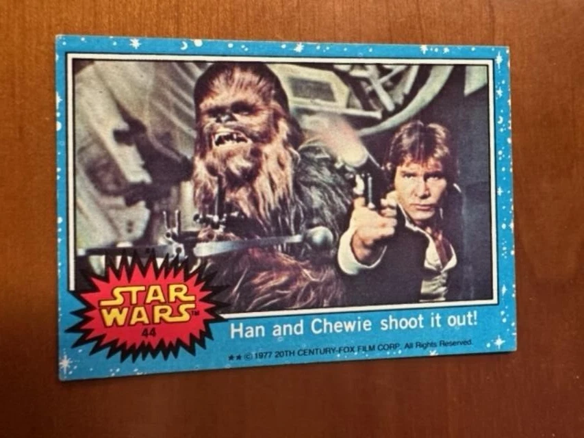 1977 Topps Star Wars Card #44 Series 1 Blue Border Han Solo & Chewbacca - Image 1 of 1