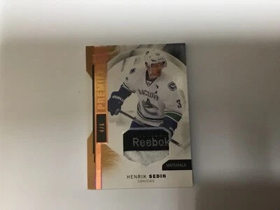 2015-16 UPPER DECK PREMIER HENRIK SEDIN MATERIALS REEBOK LOGO PATCH 4/6 - Image 1 of 3